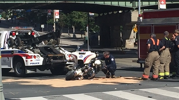 Toronto officer injured in collision when motorcycle hit by car