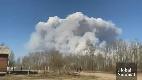 Dozens of Alberta wildfires force thousands to flee