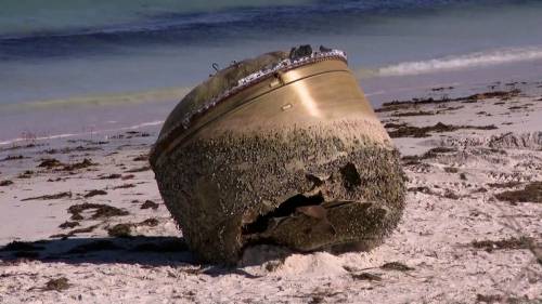 Mysterious giant metal cylinder washes up on Australian beach