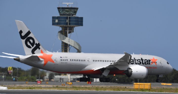 Plane passenger arrested after forcing open exit door and walking on wing – National