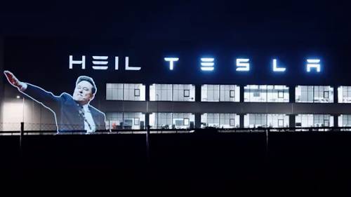 ‘Heil Tesla’: Musk’s straight-arm salute projected onto carmaker’s gigafactory